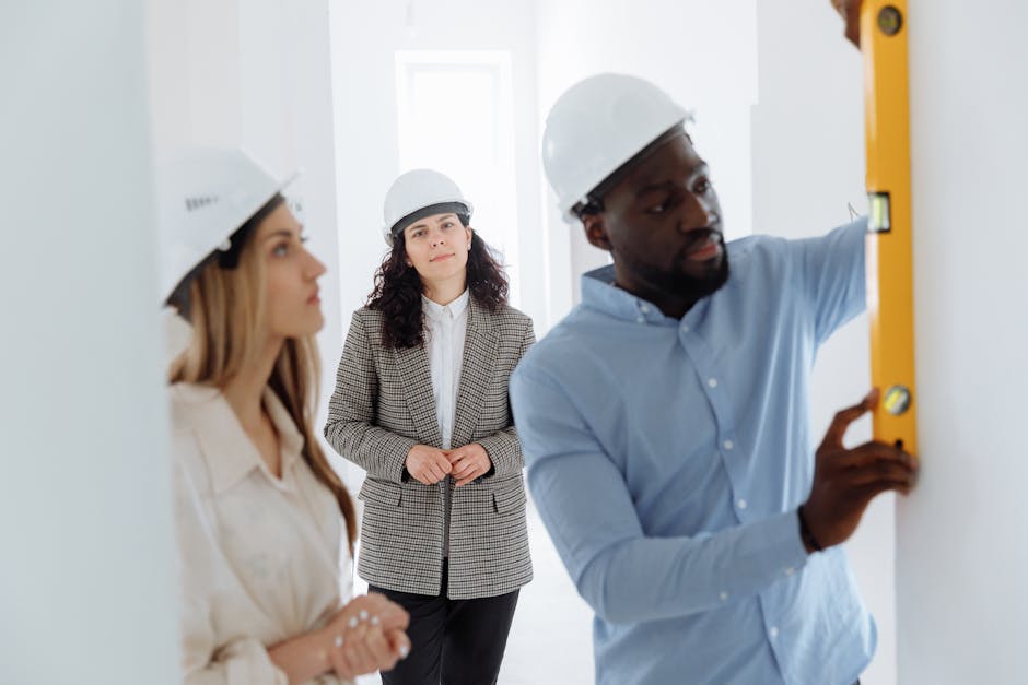 General contractor reviewing blueprints for a whole house remodeling project